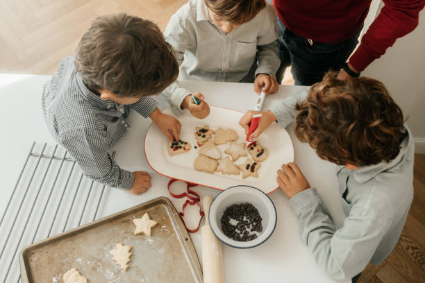 istock Boys decorating Christmas cookies 1792723973