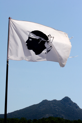 Corsica flag with mountains in background
