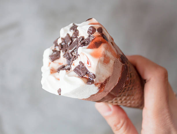 istock Melted ice cream cone in hand 179272860