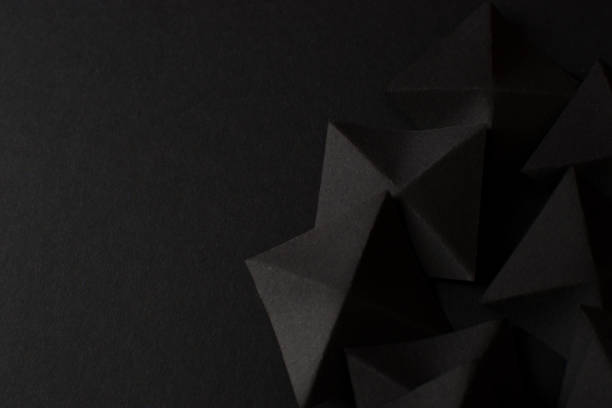 istock Black abstract geometric shapes on dark background, top view, copy space 1792730166