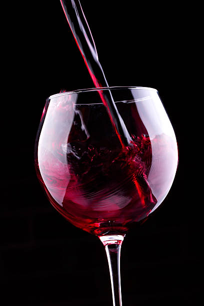 istock Splash red wine against a black background 179273318