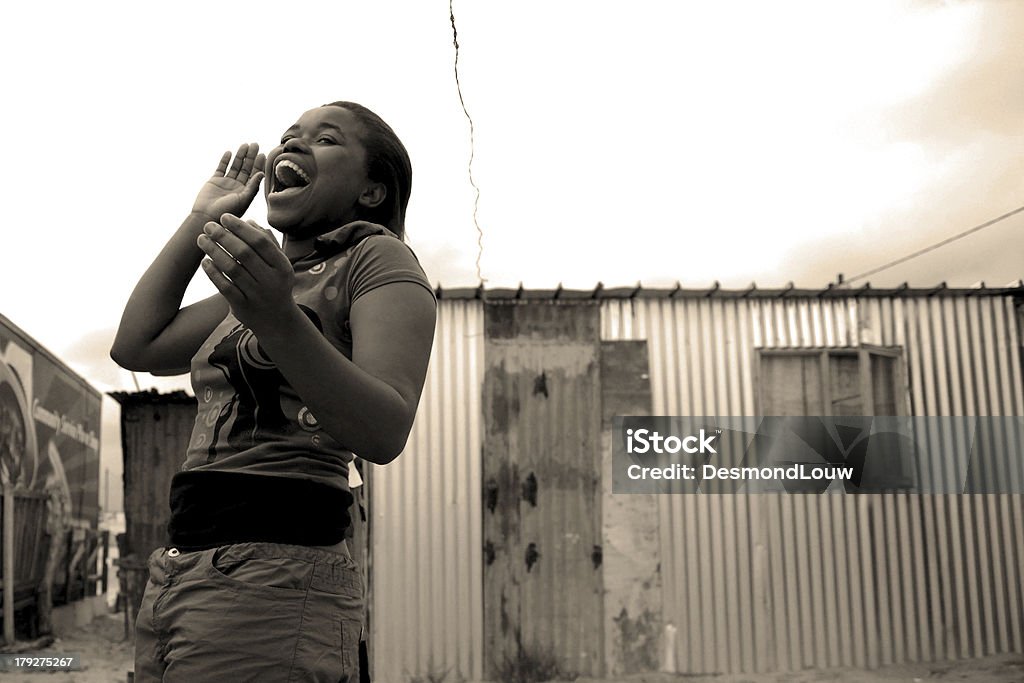 Poor but happy "Phot was taken at my friends shack in Khyalitsia township, Cape Town.my girfriend was having a conversation with Wowo (pictured) and I captured this momment!" Khayelitsha Stock Photo