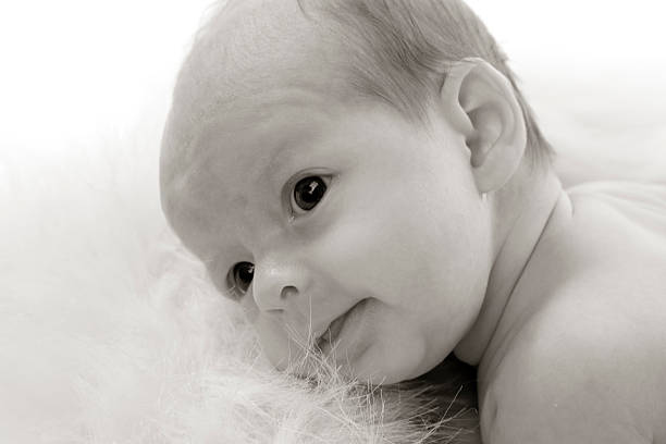 istock Newborn Baby Smiling 179275351