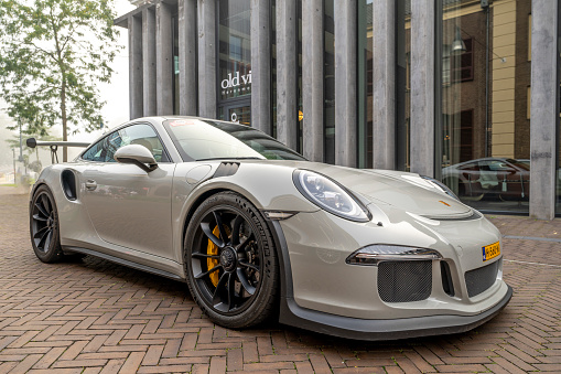 Porsche 911 GT3 RS sports car generation 991 driving on the street in Zwolle. The GT3 RS is a lightweight performance version of the Porsche 911 with improved aerodynamics.