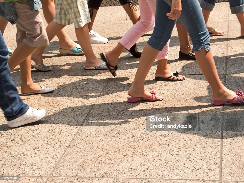 Picture of people legs walking on the street This is a shot of lots of legs walking in the city. Abstract Stock Photo