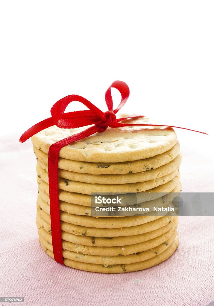Festive Christmas shortbread  wrapped pastry cookies with red Festive Christmas fresh shortbread  wrapped pastry cookies with red ribbon isolated on white background, closeup Aspirations Stock Photo