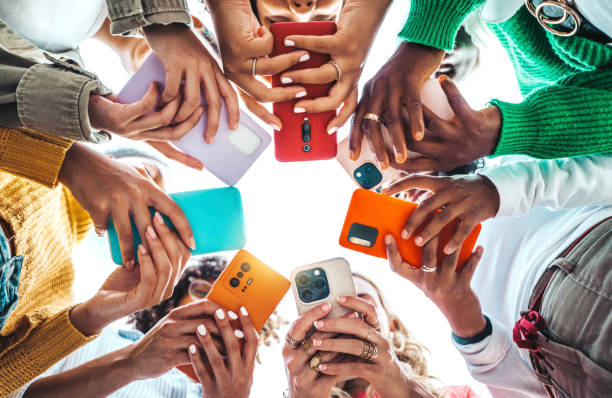 istock Group of young people using smart mobile phone device outside - Trendy technology concept with guys and girls playing video games app on smartphone - Bright colorful filter 1792771745