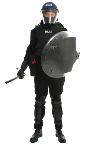 Policeman in full riot gear.