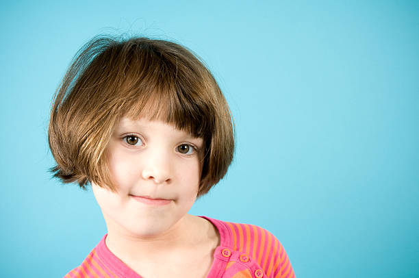istock Little Girl in Orange on Blue 179277378