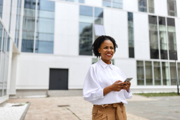istock Businesswoman using her smartphone for online banking 1792777067
