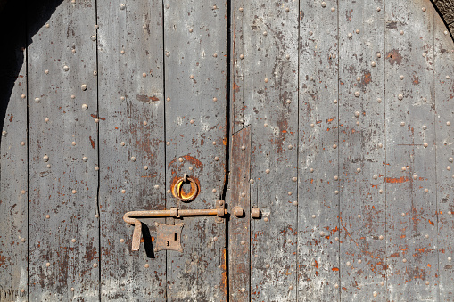 Turin, Italy - September 28, 2023: Old door in the Medieval Village, located in the Valentino Park.