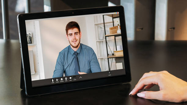 istock Online conference video man tablet woman hand 1792800061