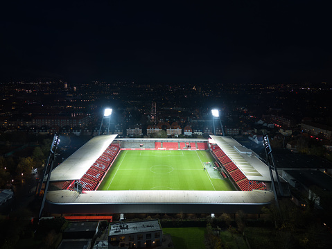 Aalborg, Denmark - November 2023: Aerial night view of the illuminated Aalborg stadion (also known as Portland park). Home stadium for AaB football club