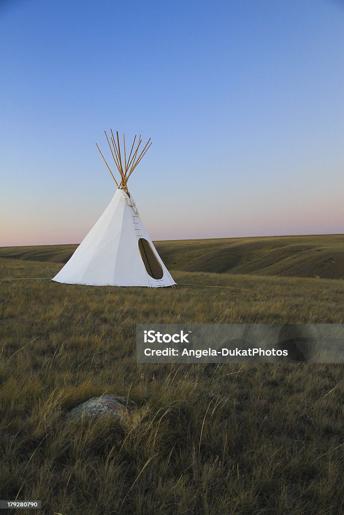teepee on the grasslands Native teepee on the grasslands of Saskatchewan, sunset in the background Saskatchewan Stock Photo
