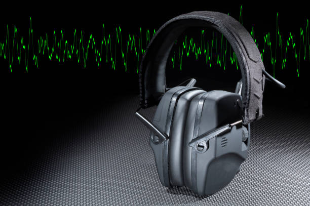 istock Copy space next to green sine wave and protective headphones 1792809364
