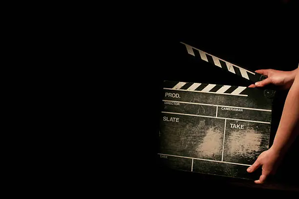 movie clapper board on black