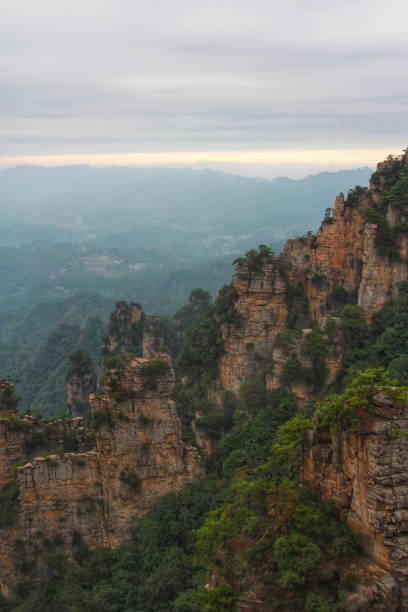 istock Majestic Mountain Greenery Beneath Overcast Skies 1792810415