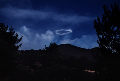 Very rare smoke ring emitted from Mount Etna volcano.