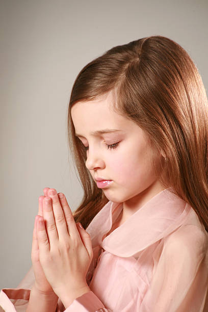 istock Young Girl Praying 179282610