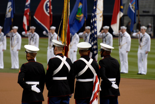Color guard at a sporting event. United States Marine Corps soldiers.