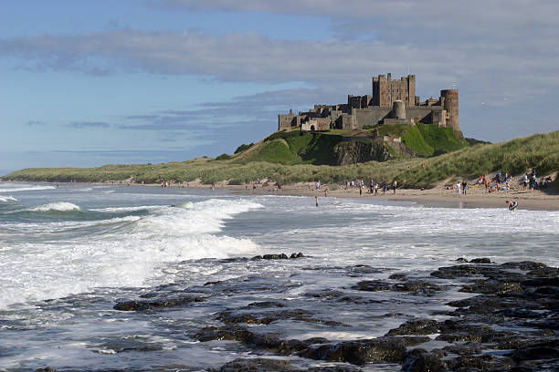 Bamburgh Castle "Bamburgh Castle is probably the finest castle in England. It is perched on a basalt outcrop on the very edge of the North Sea at Bamburgh, Northumberland. It commands stunning views of the Farne Islands, Holy Island and land' ward to the Cheviot hills." Bamburgh stock pictures, royalty-free photos & images