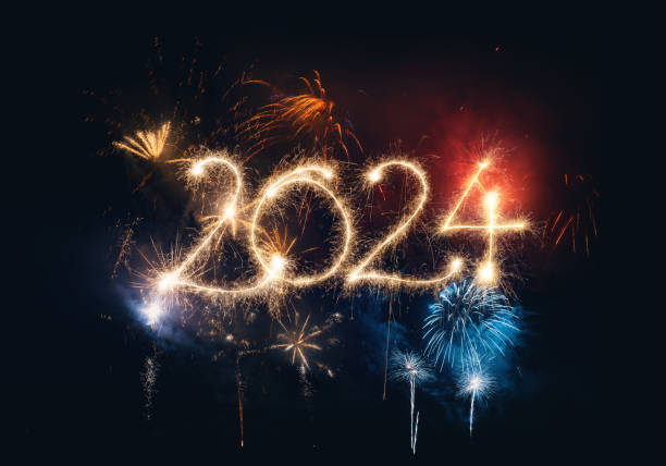 wunderkerze frohes neues jahr 2024 mit feuerwerk - new years day fotos stock-fotos und bilder