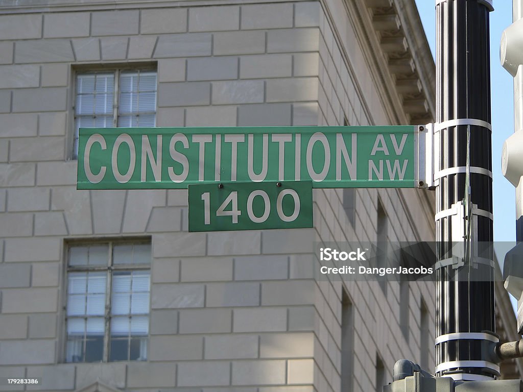 Constitution Avenue in Washington D.C. (DC) street sign A street sign on the 1400 block of Constitution Avenue in DC Adult Stock Photo