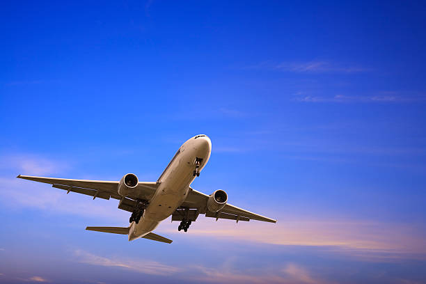 istock Jet Aeroplane Landing From Bright Blue Twilight Sky Copy Space 179283512