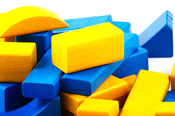 Wooden building blocks isolated on white background.