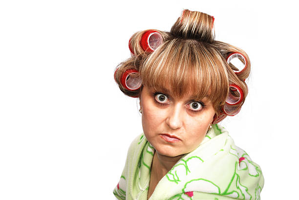 crazy mom woman with convoluted hairs and dressing-gown with the angry mien annoying mother in law stock pictures, royalty-free photos & images