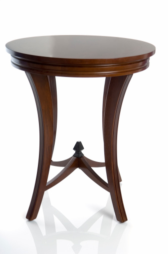 Isolated wooden end table or night stand. Seen from a straight on view which mostly obscures two of four legs. Reflection grounds table and adds class or can be easily removed.