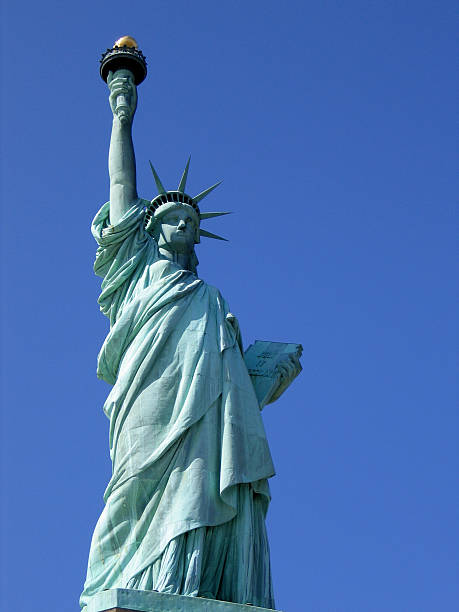 istock Statue of Liberty against blue sky. 179284381