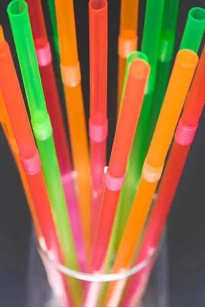 Coloured drinking-straws in a glass