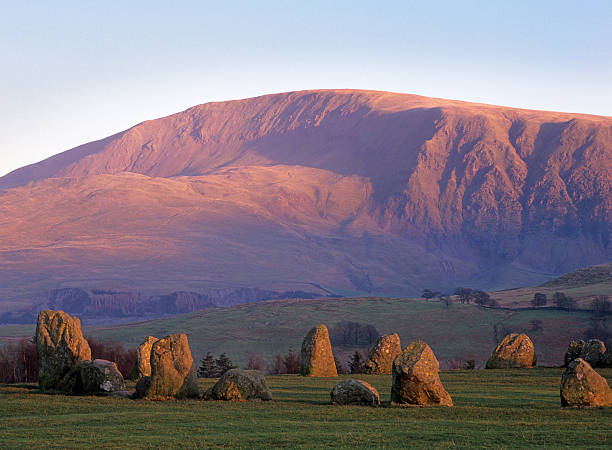 Castlerigg stone circle "Castlerigg stone circle, near Keswick in the English Lake District, in evening light" stone age stock pictures, royalty-free photos & images