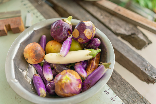 Overripe Eggplant in a Bowl Left On The Table
