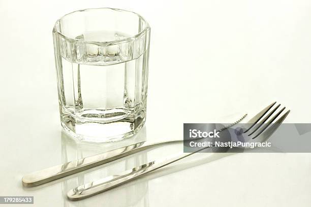 Knife And Fork With A Glass Of Water Stock Photo - Download Image Now - Fasting - Activity, Water, Drinking Glass