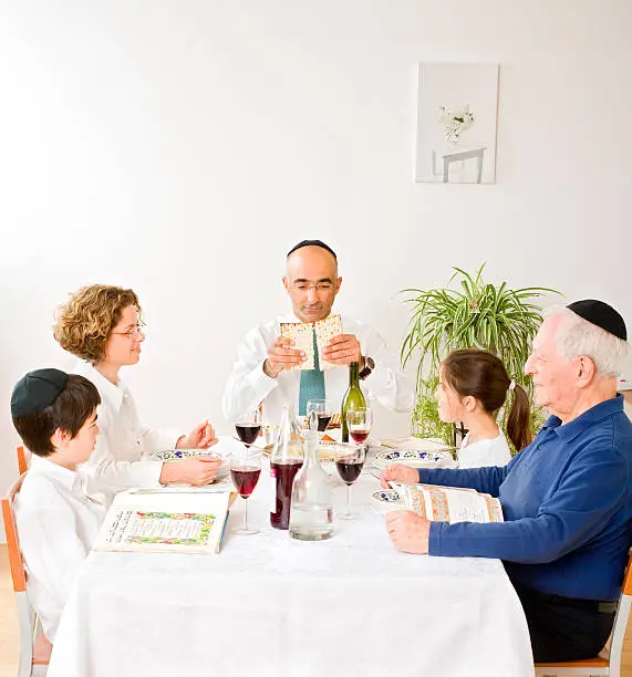 jewish family in seder celebrating passover