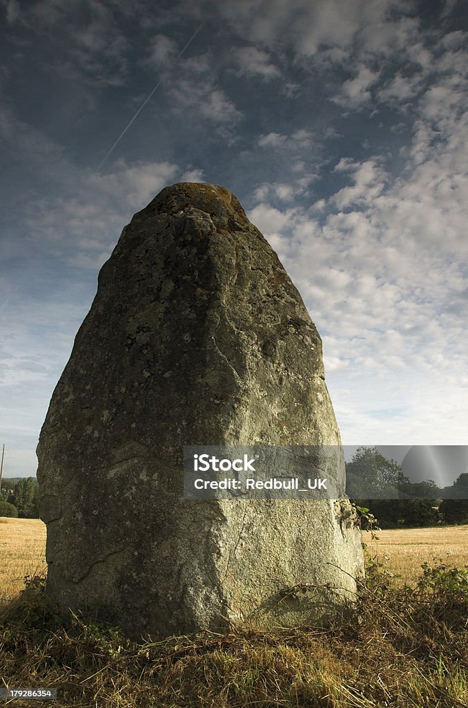 menhir "A large stone ( menhir ) in a field near La Ville Jehan, Meneac, Brittany, France" Agricultural Field Stock Photo