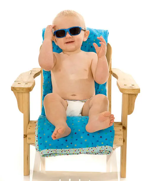 Photo of Baby with Shades Lounging Poolside