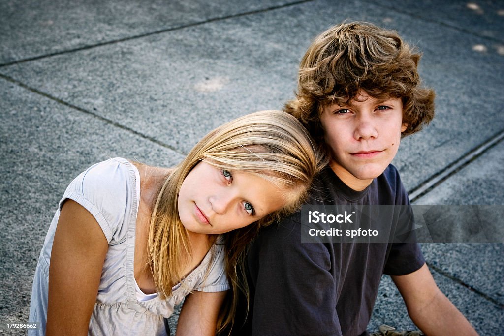 Sister rests her head on brothers shoulder in family photo Teen Brother and Sister - more of them here - Support Stock Photo