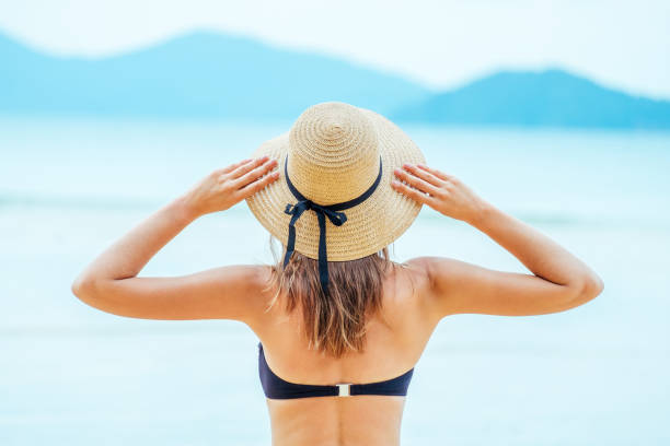 istock Woman enjoying beach relaxing in summer 1792868319