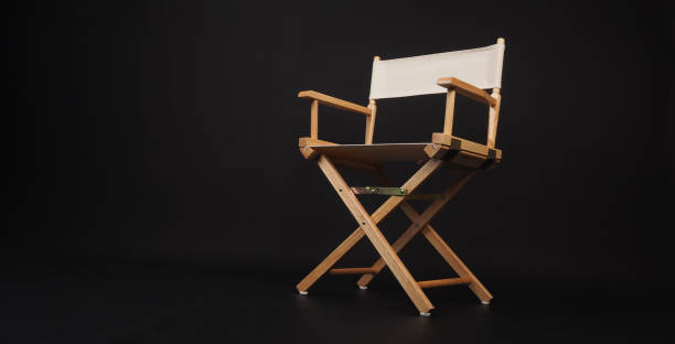 istock White director chair on black background 1792870470