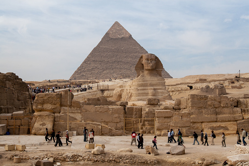Cairo, Egypt - january 1 2008 - Sphyinx and the three famous pyramids of Giza Cheops Chepren and Mykerinos