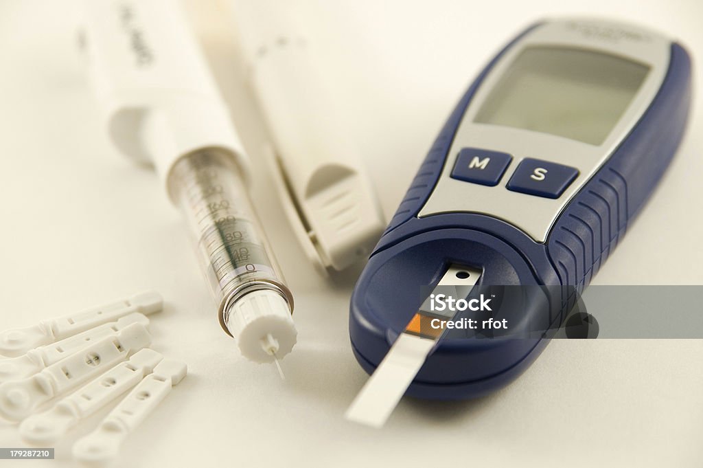 Diabetic items "Glucose meter, Insulin pen injection and lancetsMore images:" Analyzing Stock Photo