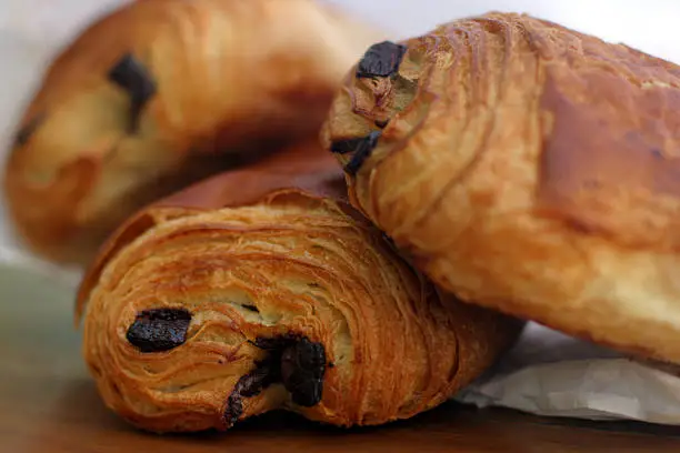 "A croissant filled with chocolate! Tasty and delicious traditional French breakfast pastry, fresh from the bakery."