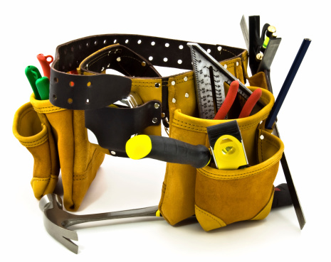 Carpenter Tools Belt and Tools - Isolated on White. New professional tools and tool belt isolated with soft shadow