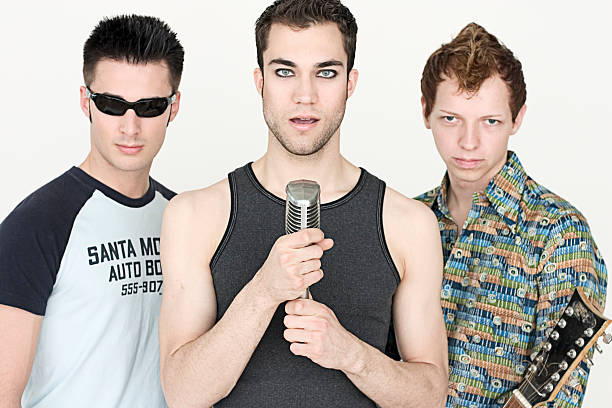 Boyband pose Three young performers in a boyband stance.Related images: boy band stock pictures, royalty-free photos & images