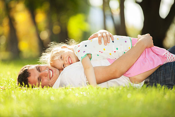 istock father and daughter in the park 179287943