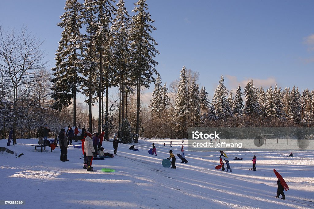 Snow playground Childrens are playing sliding on the snow field Seattle Stock Photo