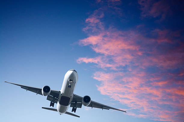 istock Jet Aeroplane Landing From Bright Twilight Sunset Sky Horizontal 179288352